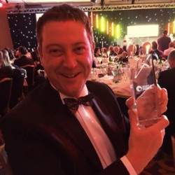 Anthony Owen collecting security excellence award