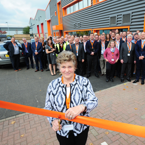 Schlüter's co-founder cutting the ribbon at the opening of the new SSEC facility